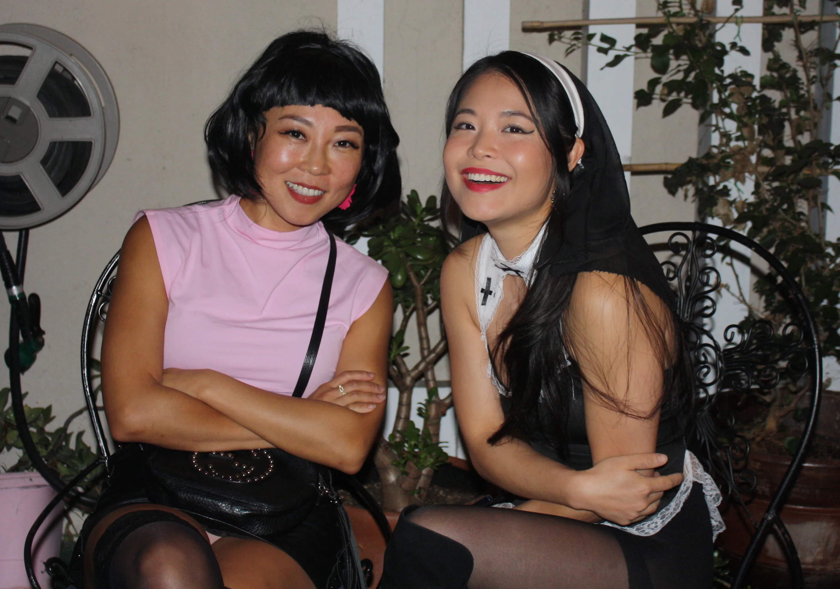 Two friends laughing in Halloween costumes